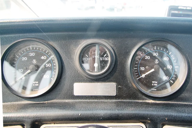 Slide: The Image of Dashboard of 1996 Carver 330 Mariner with RPM gauges. - 20