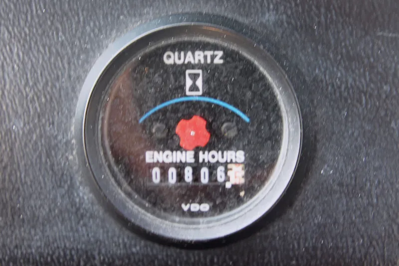 Slide: The Image of 1996 Carver 330 Mariner engine hour meter showing 806 hours. - 25