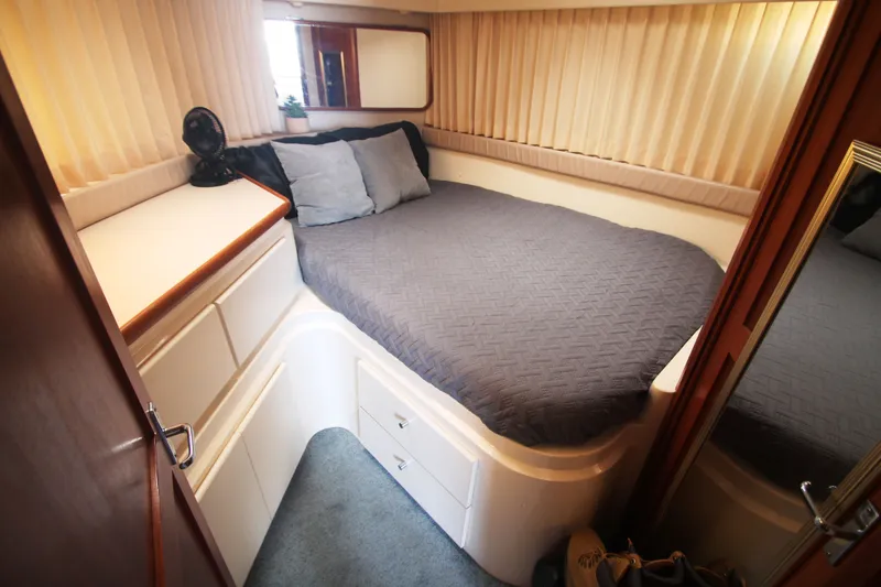 Slide: The Image of Interior of 1996 Carver 330 Mariner with cozy bed. - 38