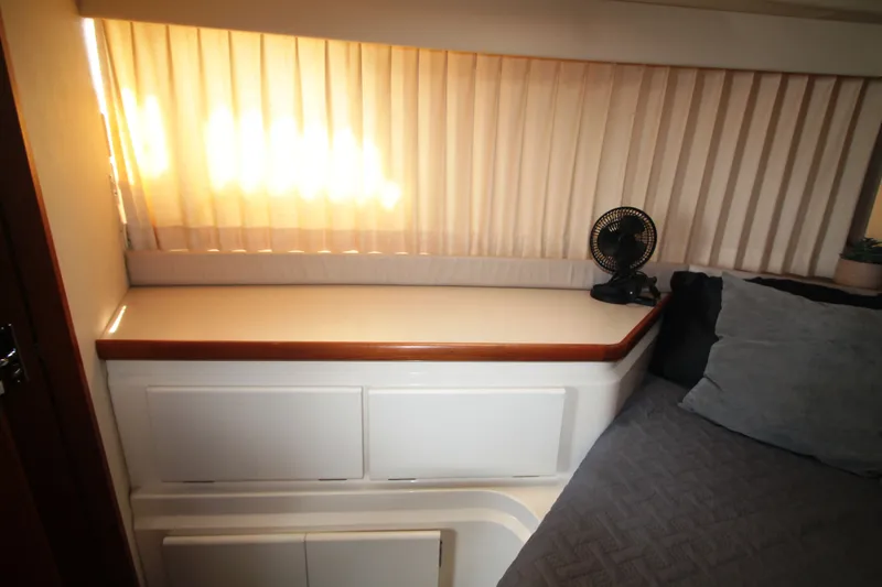 Slide: The Image of Interior of 1996 Carver 330 Mariner with bed and window. - 40