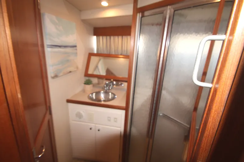 Slide: The Image of Interior of 1996 Carver 330 Mariner featuring bathroom and shower. - 43