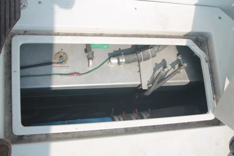 Slide: The Image of Interior view of 1996 Carver 330 Mariner boat engine. - 48