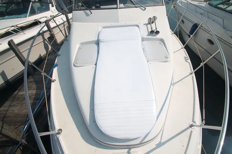 Slide: The Image of 1996 Carver 330 Mariner with sun pad on the foredeck. - 5