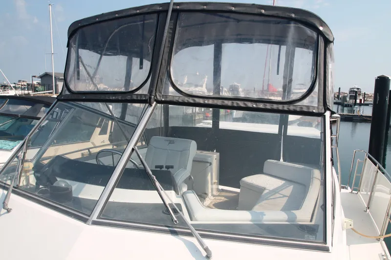 Slide: The Image of 1996 Carver 330 Mariner boat docked at marina, front view. - 9