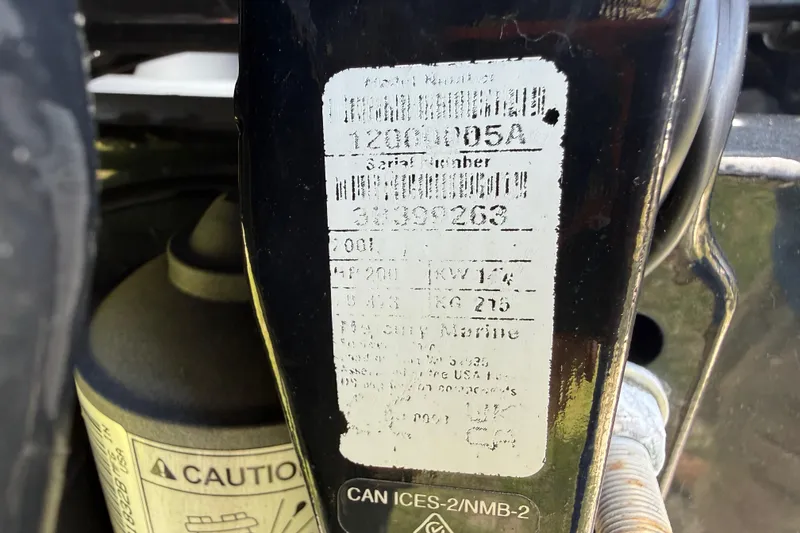 Slide: The Image of Close-up of a 2023 Regency 230 DL3 label with serial number and caution sign. - 13