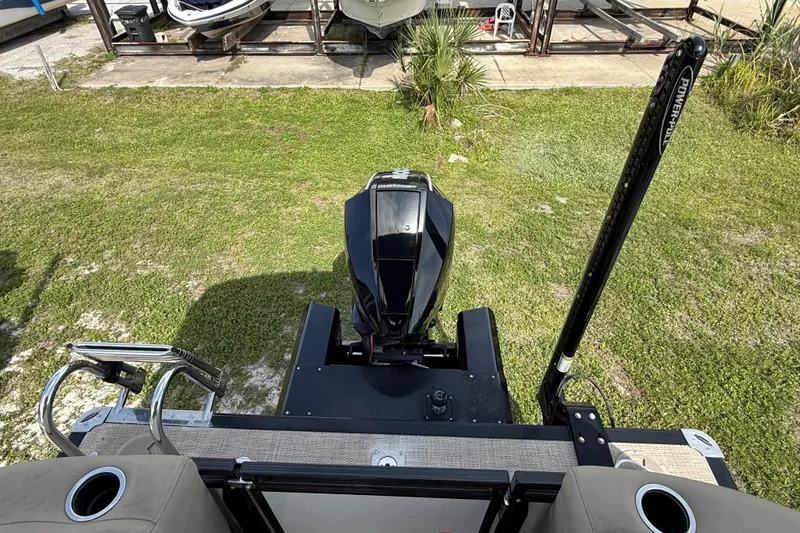 Slide: The Image of 2023 Regency 230 DL3 boat with outboard motor and Power-Pole, viewed from above. - 16