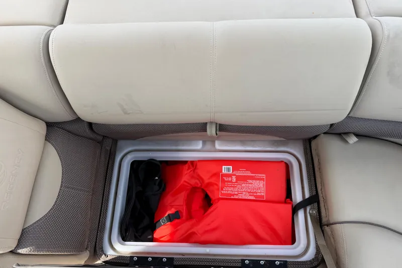 Slide: The Image of Storage compartment in 2023 Regency 230 DL3 boat with life jacket inside. - 21
