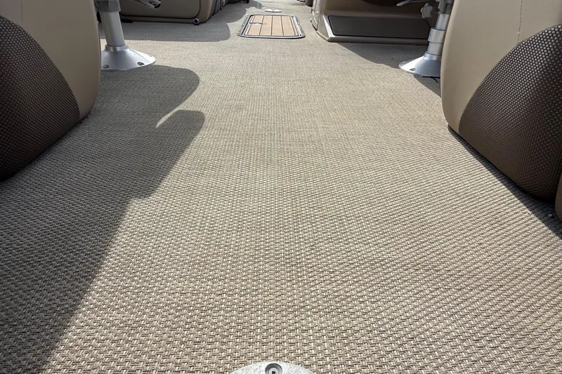 Slide: The Image of Interior view of 2023 Regency 230 DL3 boat with beige woven flooring. - 27