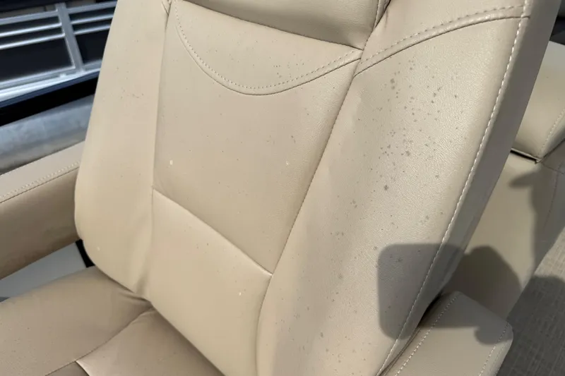 Slide: The Image of Beige leather seat with stains on a 2023 Regency 230 DL3 boat. - 30