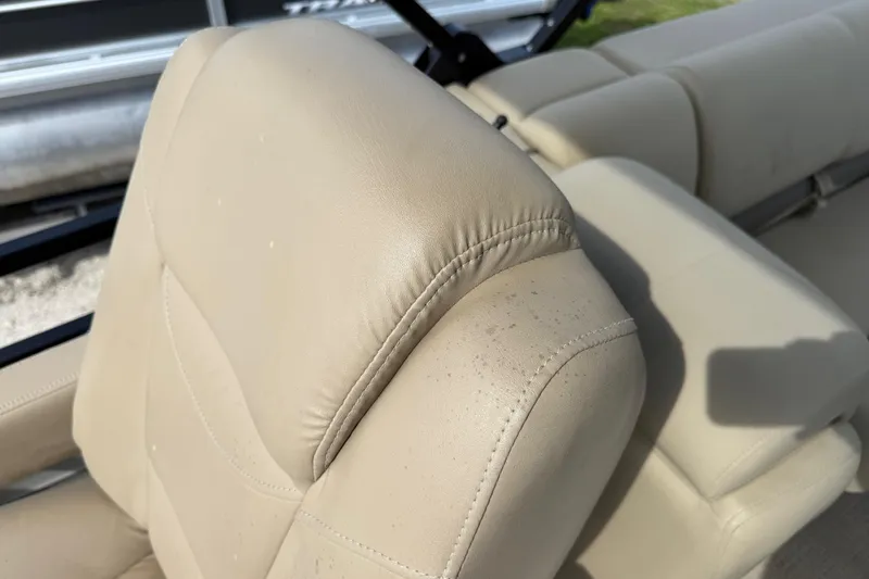 Slide: The Image of Beige leather seating on 2023 Regency 230 DL3 boat, close-up view. - 31
