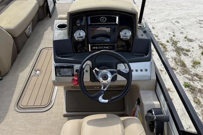 Slide: The Image of Interior view of 2023 Regency 230 DL3 boat cockpit. - 33