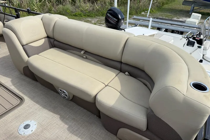Slide: The Image of Luxurious seating on 2023 Regency 230 DL3 pontoon boat with beige upholstery. - 49