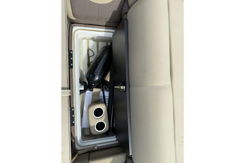 Slide: The Image of Storage compartment in 2023 Regency 230 DL3 boat with accessories and cup holders. - 53