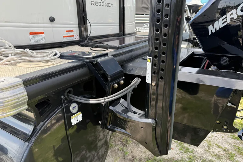 Slide: The Image of 2023 Regency 230 DL3 boat with Mercury engine and docking equipment. - 7