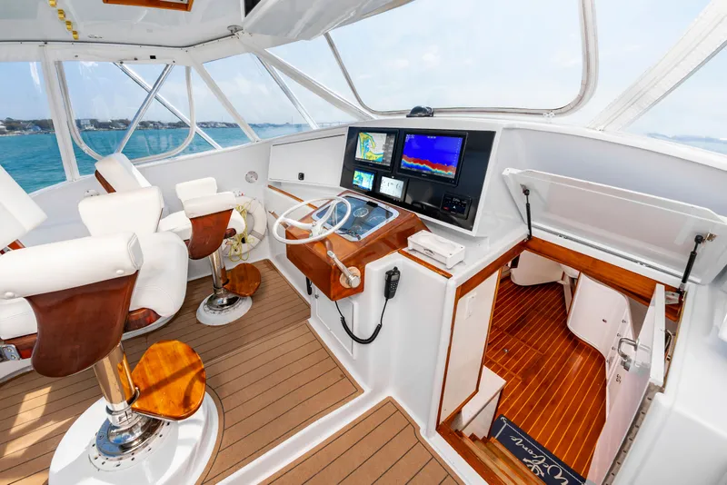 Slide: The Image of Interior of 1999 Custom Lohr 43 Express yacht with modern helm. - 10