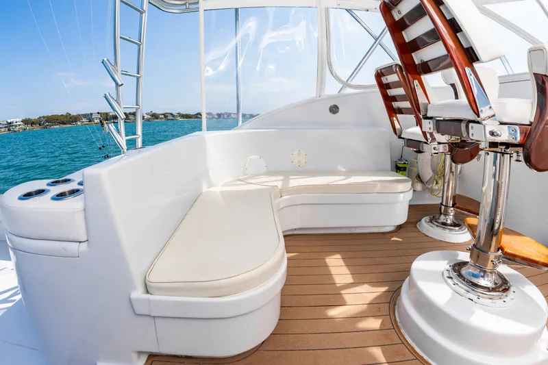 Slide: The Image of Interior of a 1999 Custom Lohr 43 Express yacht with seating area. - 13