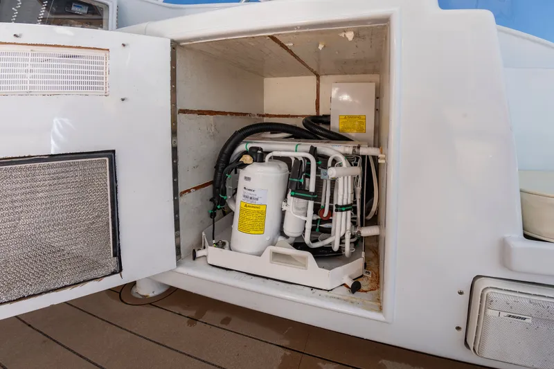 Slide: The Image of Open engine compartment of a 1999 Custom Lohr 43 Express yacht. - 16