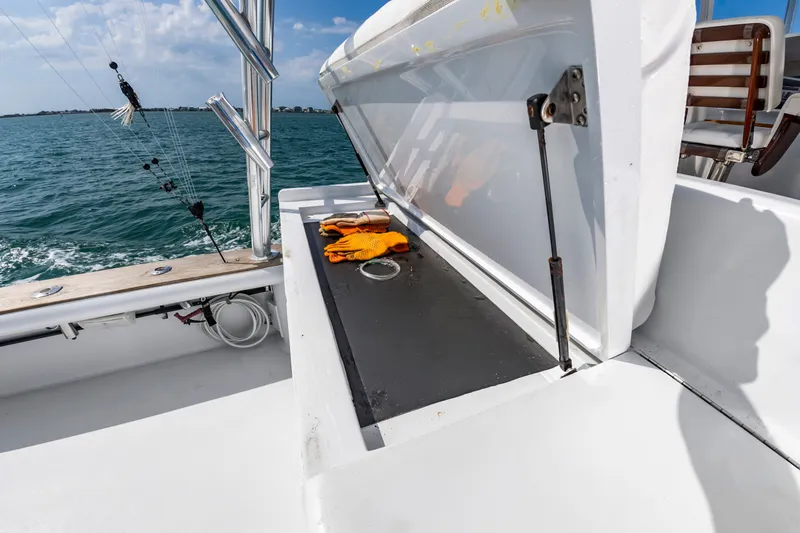 Slide: The Image of Open storage hatch on a 1999 Custom Lohr 43 Express boat. - 21
