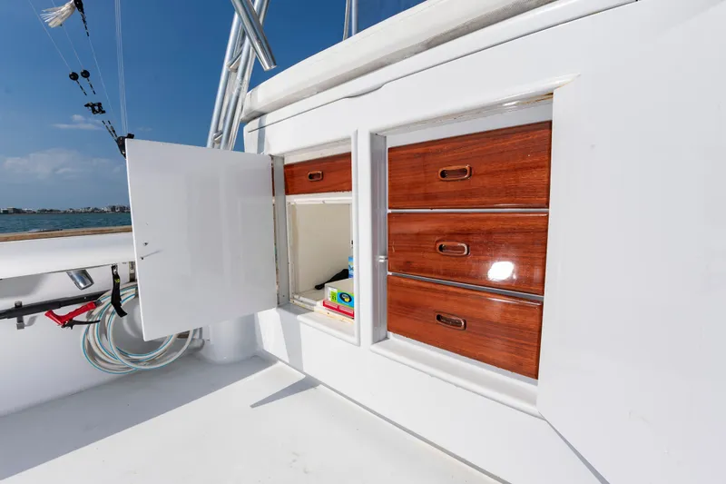 Slide: The Image of Open storage compartment on a 1999 Custom Lohr 43 Express yacht. - 23