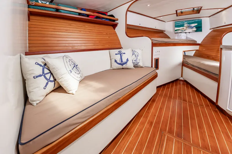 Slide: The Image of Interior of 1999 Custom Lohr 43 Express yacht with wooden floors and nautical pillows. - 31