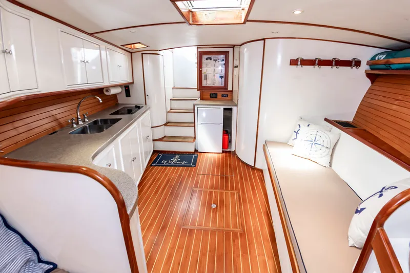 Slide: The Image of Interior of 1999 Custom Lohr 43 Express yacht with wooden flooring and kitchenette. - 36