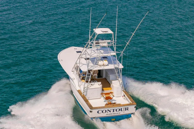 Slide: The Image of Custom Lohr 43 Express Yacht from 1999 cruising on the sea. - 4