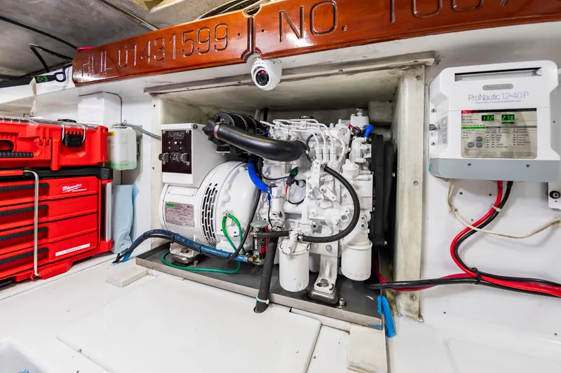 Slide: The Image of Engine room of 1999 Custom Lohr 43 Express with generator and toolbox. - 44