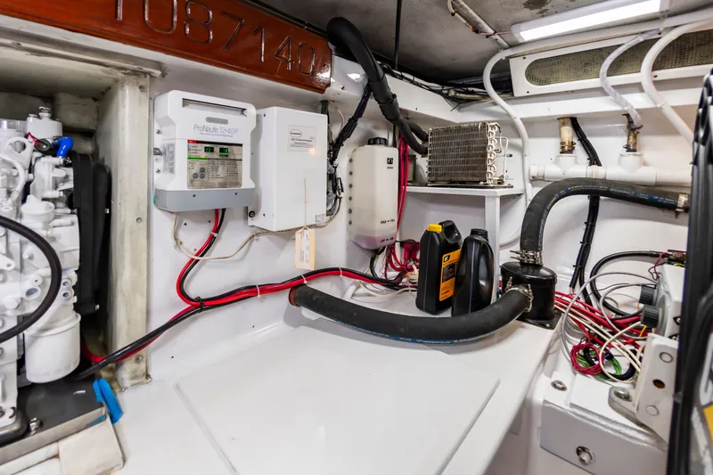 Slide: The Image of Engine room of 1999 Custom Lohr 43 Express with wiring and equipment. - 49