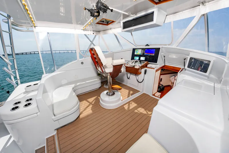 Slide: The Image of Interior of a 1999 Custom Lohr 43 Express yacht with modern amenities. - 9