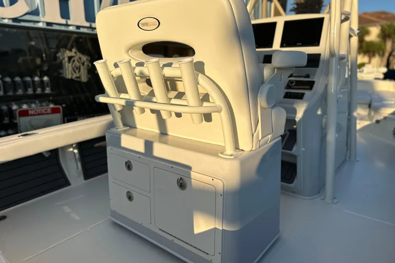 Slide: The Image of 2026 Pathfinder 2600 TRS boat interior with rod holders and control panel. - 17