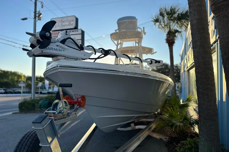 Slide: The Image of 2026 Pathfinder 2600 TRS boat on trailer with Garmin equipment, parked outdoors. - 20