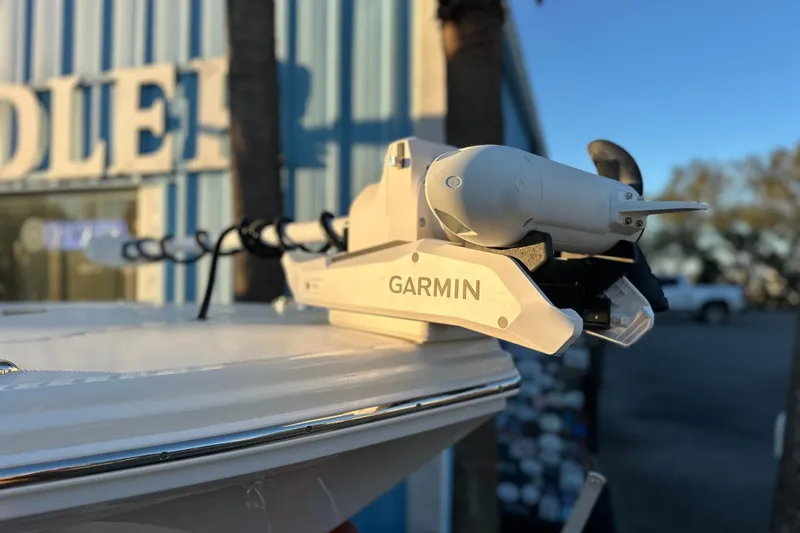 Slide: The Image of 2026 Pathfinder 2600 TRS boat with Garmin equipment, docked near a building. - 21