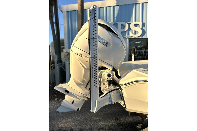 Slide: The Image of 2026 Pathfinder 2600 TRS boat with Yamaha outboard motor, displayed outdoors. - 25