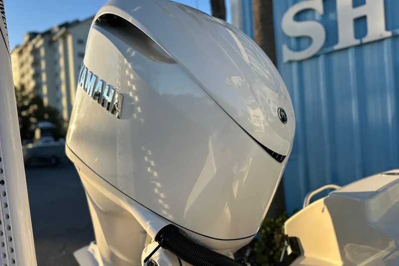 Slide: The Image of Yamaha outboard motor on 2026 Pathfinder 2600 TRS boat, with blue building background. - 26
