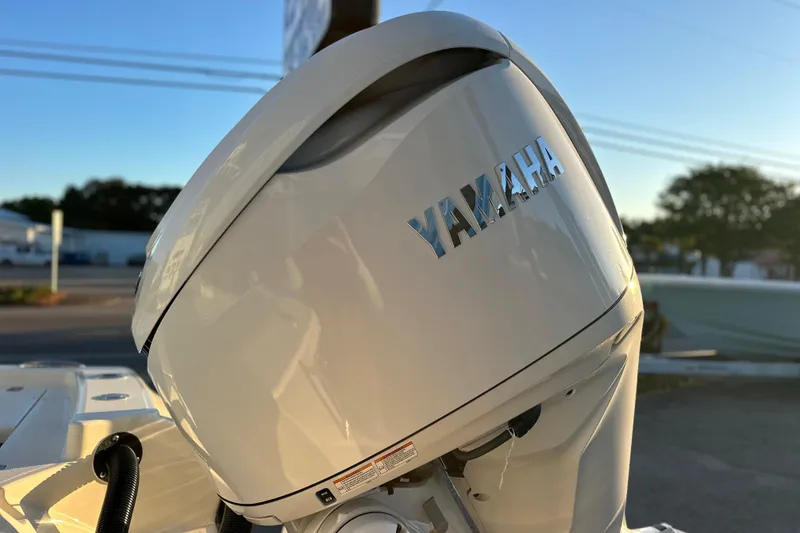 Slide: The Image of 2026 Pathfinder 2600 TRS with Yamaha outboard motor in sunlight. - 28
