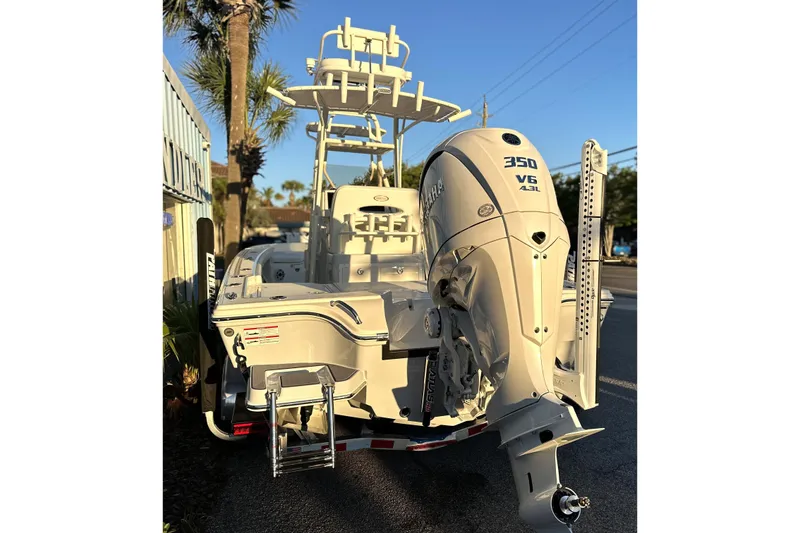 Slide: The Image of 2026 Pathfinder 2600 TRS boat with powerful 350 V6 engine, parked outdoors. - 29