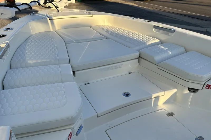 Slide: The Image of Luxurious seating area on a 2026 Pathfinder 2600 TRS boat, featuring quilted cushions. - 4