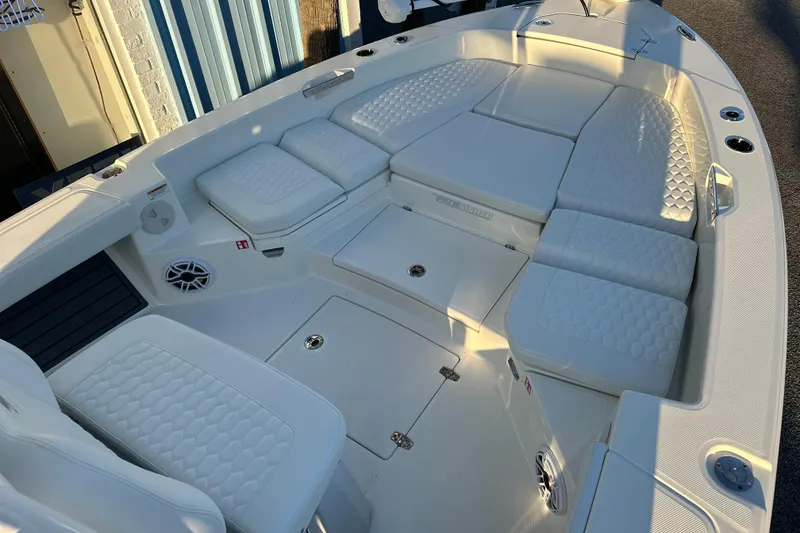 Slide: The Image of 2026 Pathfinder 2600 TRS boat interior with white cushioned seating and modern design. - 5