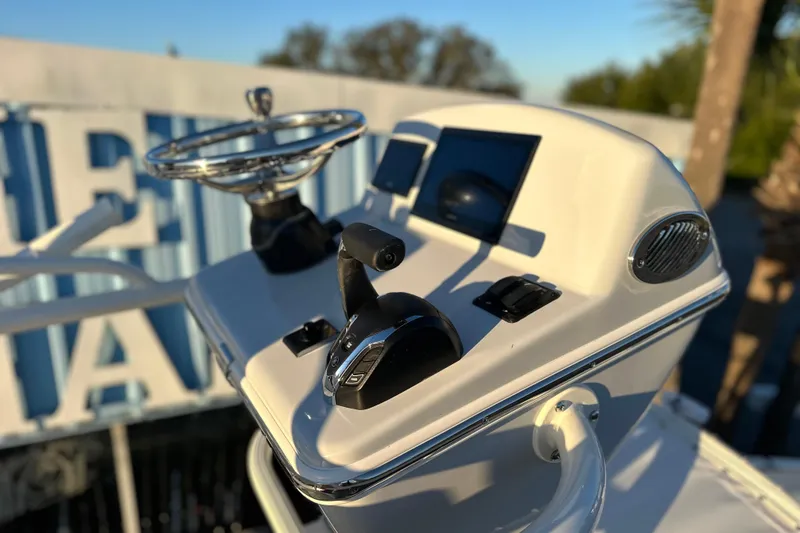 Slide: The Image of 2026 Pathfinder 2600 TRS boat console with steering wheel and controls. - 7