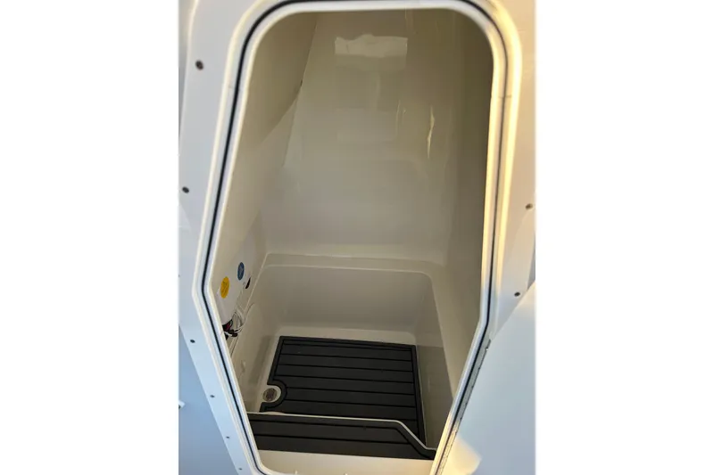 Slide: The Image of Interior compartment of 2026 Pathfinder 2600 TRS boat, featuring sleek design and utility space. - 8