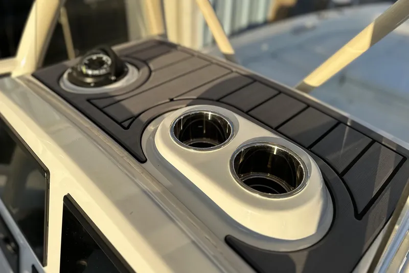 Slide: The Image of 2026 Pathfinder 2600 TRS boat dashboard with cup holders and compass. - 9