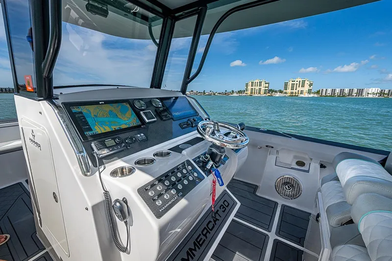 Slide: The Image of Cockpit view of 2025 Hammer Yachts 30, featuring modern navigation and control systems. - 17