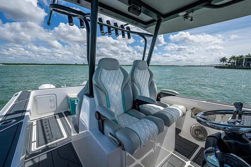 Slide: The Image of Luxurious interior of 2025 Hammer Yachts 30, featuring plush seating and sleek design on open water. - 19