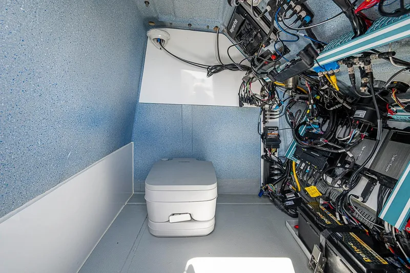 Slide: The Image of Interior of 2025 Hammer Yachts 30, featuring compact toilet and electrical systems. - 24