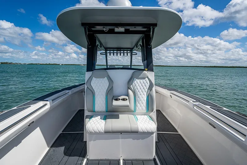 Slide: The Image of 2025 Hammer Yachts 30 boat interior with modern seating on open water. - 31