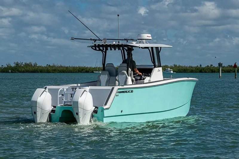 Slide: The Image of 2025 Hammer Yachts 30 cruising on a sunny day with dual engines. - 4