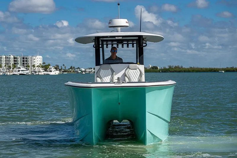 Slide: The Image of 2025 Hammer Yachts 30 cruising on a sunny day with modern design. - 8