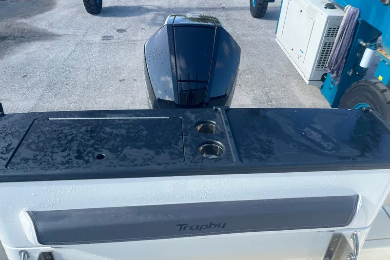 Slide: The Image of 2025 Bayliner Trophy T25 Pilothouse boat with sleek design and wet surfaces. - 8