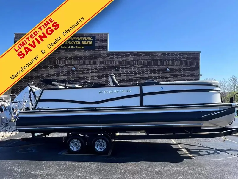 The Image of The image shows a Premier 250 Solaris RL boat on a trailer in front of a building. A yellow banner with "LIMITED-TIME SAVINGS" overlays the image. - 1
