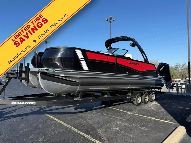 The Image of The image shows a Premier 270 Supersport RF boat on a trailer with a promotional banner. - 1